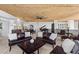 Open-concept living area with leather sofas, grand piano, artwork, and access to cityscape views at 360 E Desert Inn Rd # 1903, Las Vegas, NV 89109
