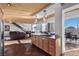 Open layout with a kitchen, dining area, and living area with stairs, creating a modern and spacious living space at 360 E Desert Inn Rd # 1903, Las Vegas, NV 89109