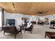 Open-concept living area features leather seating, artwork, grand piano and views at 360 E Desert Inn Rd # 1903, Las Vegas, NV 89109