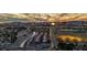 Expansive aerial view capturing city streets, nearby neighborhood, and distant mountain range under a vibrant sky at 3731 Spencer St, Las Vegas, NV 89119