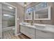 Stylish bathroom featuring double sinks, modern fixtures, and a sleek shower at 3731 Spencer St, Las Vegas, NV 89119