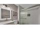 Updated bathroom featuring a vanity with a single sink and a shower at 3731 Spencer St, Las Vegas, NV 89119