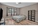 Bedroom features natural light, wood flooring and closet storage at 3731 Spencer St, Las Vegas, NV 89119