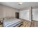 Bedroom features natural light, wood flooring and closet storage at 3731 Spencer St, Las Vegas, NV 89119