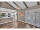 Bright dining area with wood floors, modern lighting, and access to outdoor pool area at 3731 Spencer St, Las Vegas, NV 89119