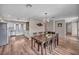 Open concept Dining Room featuring eat-in kitchen and contemporary light fixture at 3731 Spencer St, Las Vegas, NV 89119