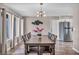 Dining Room featuring hardwood floors and contemporary light fixture at 3731 Spencer St, Las Vegas, NV 89119