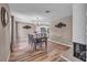 Open concept Dining Room with adjacent eat-in kitchen and fireplace at 3731 Spencer St, Las Vegas, NV 89119