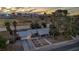 Charming single-story home with attached garage and desert landscaping, set against a vibrant Las Vegas skyline at sunset at 3731 Spencer St, Las Vegas, NV 89119