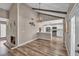 Spacious living room with fireplace, exposed beams and an open view of the modern kitchen at 3731 Spencer St, Las Vegas, NV 89119