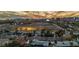 An expansive cityscape view of the neighborhood featuring distant mountains, buildings, and a large field at 3731 Spencer St, Las Vegas, NV 89119