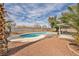 A backyard swimming pool surrounded by gravel, concrete walkway, and block wall that offers plenty of privacy at 3731 Spencer St, Las Vegas, NV 89119
