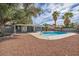 Backyard features a private pool surrounded by desert landscaping at 3731 Spencer St, Las Vegas, NV 89119