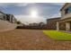 Spacious backyard featuring gravel, a small patch of turf and perimeter walls for privacy at 3771 Bright Aquarius Ln, Henderson, NV 89052