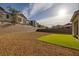 Wide backyard with gravel and a small patch of turf with block wall for added privacy at 3771 Bright Aquarius Ln, Henderson, NV 89052
