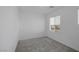 Bright bedroom features neutral carpet, white walls, and a window allowing natural light at 3771 Bright Aquarius Ln, Henderson, NV 89052