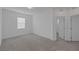 Bright bedroom features neutral carpet, white walls, and a window allowing natural light at 3771 Bright Aquarius Ln, Henderson, NV 89052