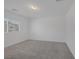 Bedroom with neutral carpet, white walls and a window allowing natural light to fill the room at 3771 Bright Aquarius Ln, Henderson, NV 89052