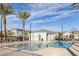 Community pool featuring tall palm trees with a bath house and various lounge seating at 3771 Bright Aquarius Ln, Henderson, NV 89052