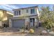 Charming two-story home with a two-car garage and desert landscaping at 3771 Bright Aquarius Ln, Henderson, NV 89052