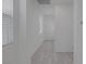 Bright hallway with neutral paint and modern tile floors leads to the home's entrance at 3771 Bright Aquarius Ln, Henderson, NV 89052