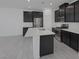 Modern kitchen features stainless steel appliances, dark cabinets, and a spacious island at 3771 Bright Aquarius Ln, Henderson, NV 89052