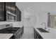 Open concept kitchen with stainless steel appliances and view to dining area at 3771 Bright Aquarius Ln, Henderson, NV 89052