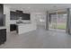 Open-concept living space features new tile floors, modern kitchen, and sliding glass doors to the backyard at 3771 Bright Aquarius Ln, Henderson, NV 89052