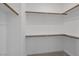 Large walk-in closet features ample shelving, closet rods and neutral carpet at 3771 Bright Aquarius Ln, Henderson, NV 89052