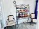 Cozy dining nook showcasing a metal bakers rack, dining table and two chairs at 3856 Commanche Ave, Las Vegas, NV 89121