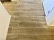 Close up on newly installed wood look tile flooring in the home at 3856 Commanche Ave, Las Vegas, NV 89121