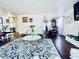 View of living room leading to the dining area with hardwood floors, elegant vintage furniture, and area rug at 3856 Commanche Ave, Las Vegas, NV 89121