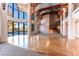 Spacious living room filled with natural light and featuring a wooden staircase at 42 Gulf Stream Ct, Las Vegas, NV 89113