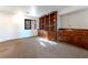 Carpeted room with wooden built-ins, cabinets, and ample storage space at 42 Gulf Stream Ct, Las Vegas, NV 89113