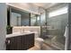 Modern bathroom featuring a sleek glass shower, elegant vanity, and contemporary fixtures and tiling at 42 Lakefront Dr, Henderson, NV 89011