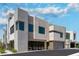 Stunning modern home featuring a unique façade, large windows, and meticulous landscaping, creating curb appeal at 42 Lakefront Dr, Henderson, NV 89011