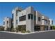 Modern home exterior with clean lines, unique architectural details, and manicured landscaping at 42 Lakefront Dr, Henderson, NV 89011