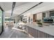 Bright, open kitchen features a large island, modern appliances, and seamless flow to the living area with water views at 42 Lakefront Dr, Henderson, NV 89011