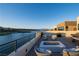 Rooftop terrace offering panoramic lake views, a cozy fire pit, and ample seating, ideal for outdoor relaxation at 42 Lakefront Dr, Henderson, NV 89011