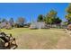 Expansive backyard featuring a storage shed, mature trees, and outdoor seating at 425 Bonelli Ave, Overton, NV 89040