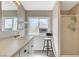 Bright bathroom showcasing a vanity with ample counter space and glass-enclosed shower at 425 Bonelli Ave, Overton, NV 89040