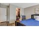 Cozy bedroom with a wooden bed frame, wood-look flooring, and a walk-in closet at 425 Bonelli Ave, Overton, NV 89040