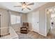 Bedroom featuring a ceiling fan, a crib and a comfortable chair perfect for a baby room at 425 Bonelli Ave, Overton, NV 89040