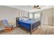 Well-lit bedroom with neutral paint colors, wood flooring, and a ceiling fan at 425 Bonelli Ave, Overton, NV 89040