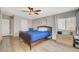 Cozy bedroom features wood floors, neutral walls, natural light, and a ceiling fan at 425 Bonelli Ave, Overton, NV 89040
