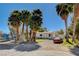 Charming single story home with gravel and green landscaping and a vintage car at 425 Bonelli Ave, Overton, NV 89040