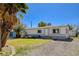 Charming single story home with a well-manicured lawn and gravel landscaping at 425 Bonelli Ave, Overton, NV 89040