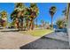 A close view of the front yard featuring gravel landscaping and a concrete patio at 425 Bonelli Ave, Overton, NV 89040