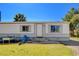 A cozy single story home with green grass, gravel landscaping, and some chairs at 425 Bonelli Ave, Overton, NV 89040