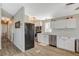 Bright kitchen features white cabinets, stainless steel appliances, and wood look flooring at 425 Bonelli Ave, Overton, NV 89040